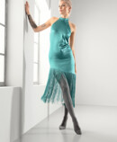 2. Lifestyle image Juzo Inspiration Woman with Juzo Inspiration and tights in poppy and petrol-colored dress