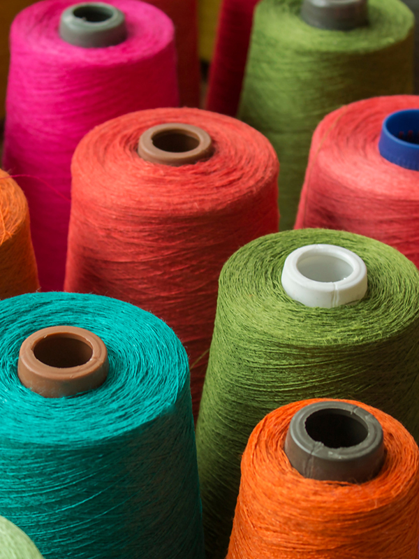 Bobbins with different coloured threads Bobbins with different coloured threads